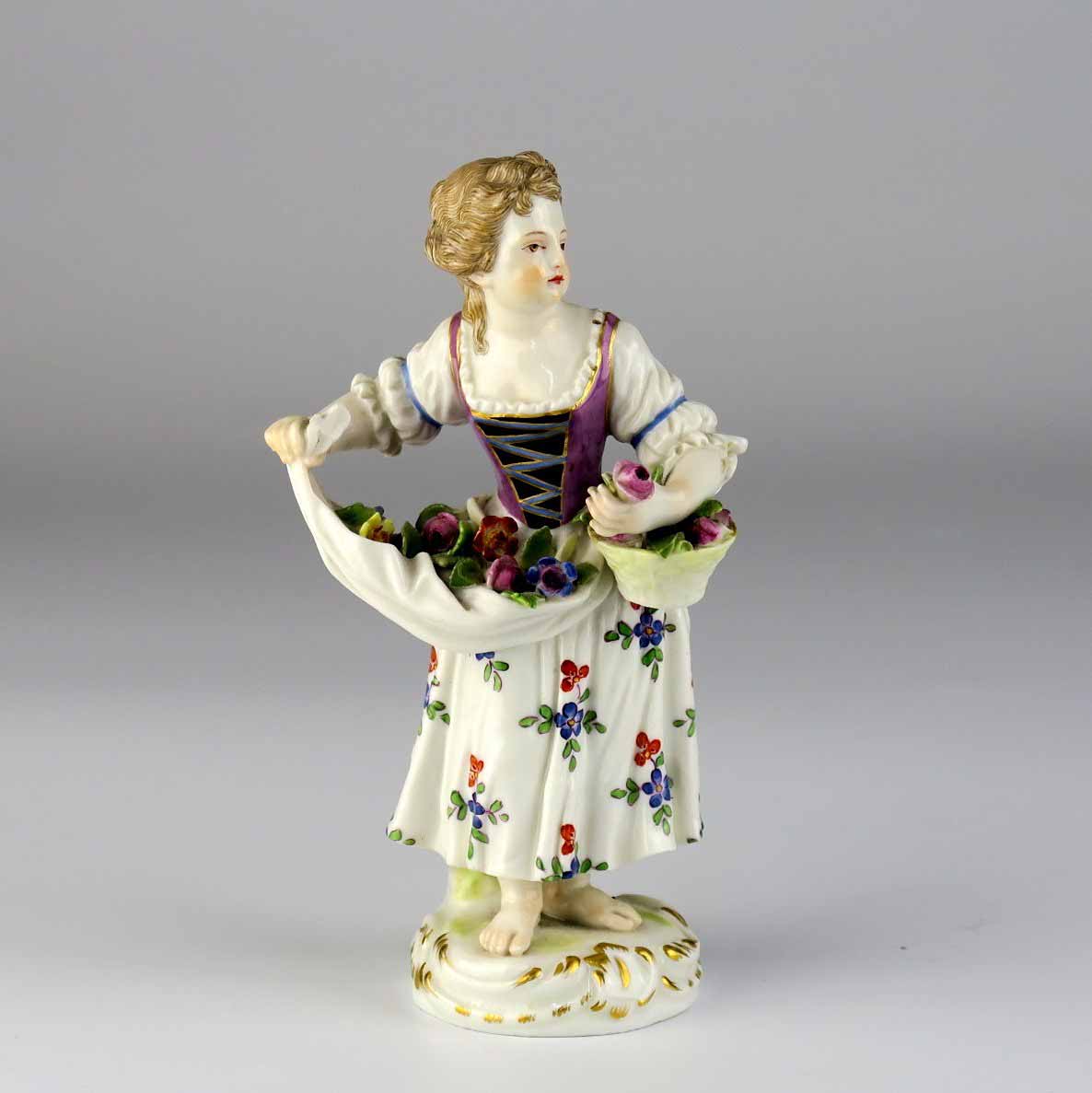 Zahradnice s květy v zástěře