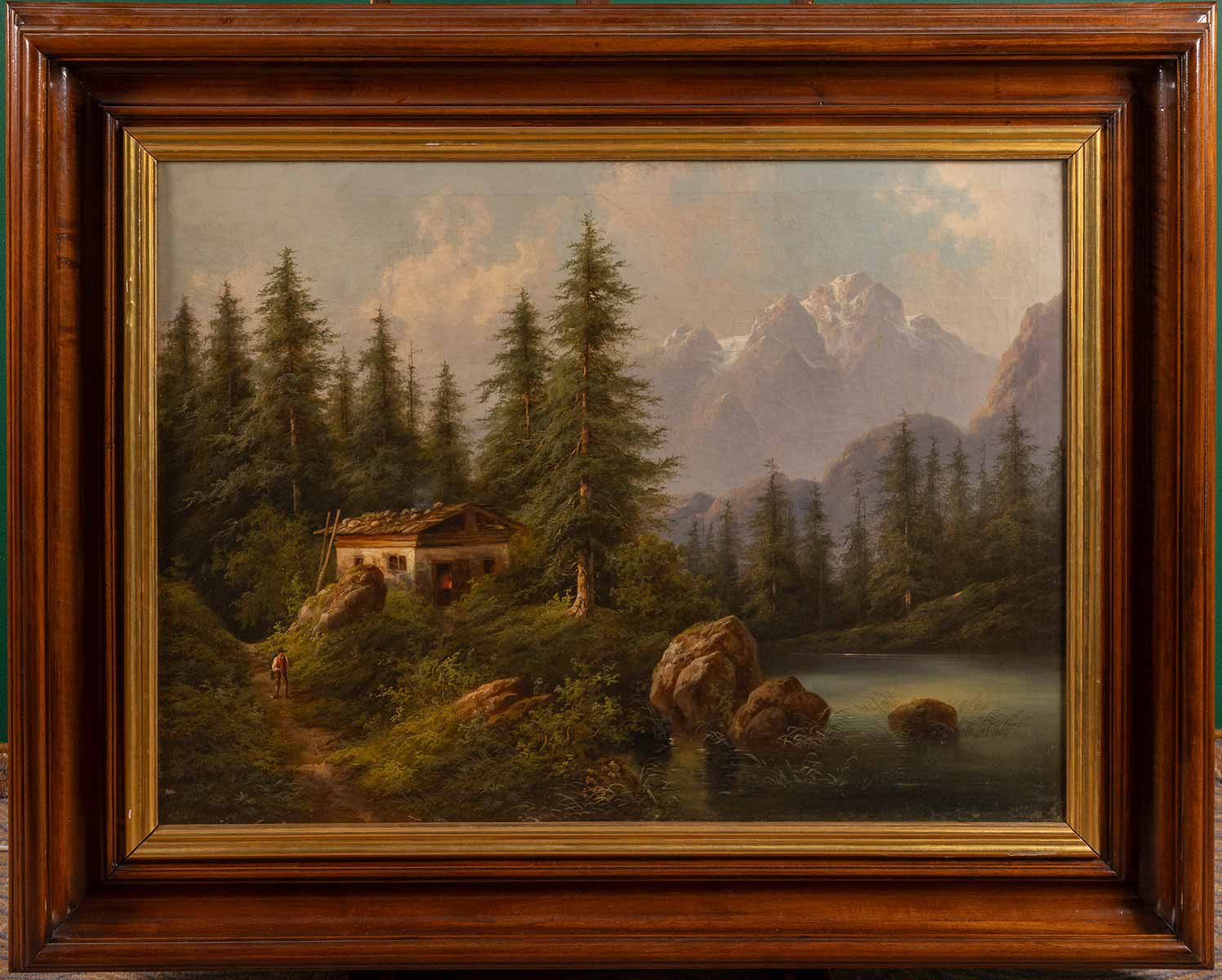 Alpská krajina se stavením a říčkou